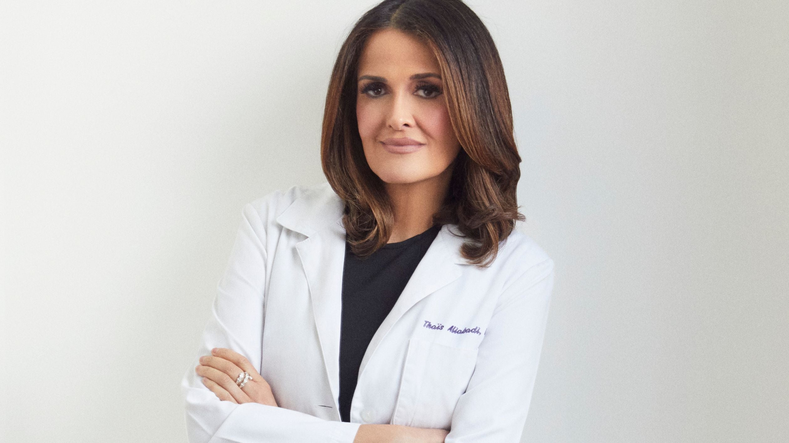 Portrait of Dr. Aliabadi, a medical professional specializing in women's health, with a focus on PCOS treatment and management. Dr. Aliabadi is shown in a clinical setting, offering guidance on how supplements can help manage PCOS symptoms such as hormonal imbalances, insulin resistance, and irregular cycles. As an expert in the field, Dr. Aliabadi often recommends various PCOS supplements to support overall health and improve quality of life for those living with polycystic ovary syndrome (PCOS)."